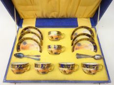 Set of six Noritake teacups and saucers decorated with desert camel scene with blue border and