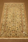 Kashan ivory ground rug, central medallion, floral and foliate field,