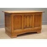 Mid 20th century oak blanket box, planked top with linenfold centre panel front on bracket feet,