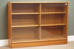 Mid to late 20th century Teak bookcase with sliding glass doors enclosing two adjustable shelves,