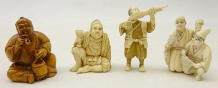 Three Japanese Meiji period Ivory Netsukes, a seated man holding a goblet, man with pistol,