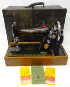 Early 20th century Singer sewing machine with original instructions and case