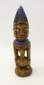 Yoruba male Ibeji Nigeria twin figure with blue beaded necklace and blue pigment,