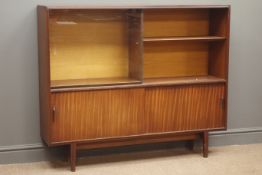 Mid to late 20th century teak bookcase with sliding glass door, adjustable shelves,
