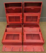 Four red finish locker style wall racks,