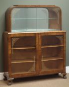 Early 20th century walnut display cabinet, two glass sliding doors enclosing mirrored interior,