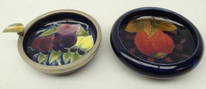 Moorcroft dish decorated in the pomegranate pattern on blue ground, D11cm,