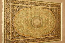 Keshan green ground rug, central medallion,