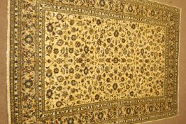 Kashan beige ground rug, floral and foliate field, repeating border,