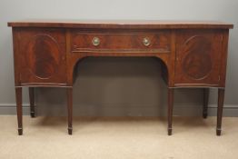 Early 20th century mahogany serpentine sideboard, fitted with centre drawer and two cupboards,