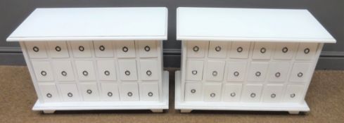 Two white finish apothecary style chests, each with eighteen loop handled drawers on bracket feet,