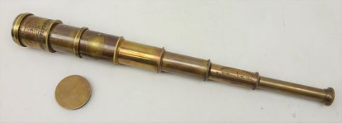 Reproduction brass telescope with plaque reading 'Victorian Marine Telescope London - 1915' and