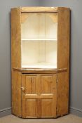 Early 20th century pine corner cupboard, two display shelves above panelled cupboard door, W90cm,
