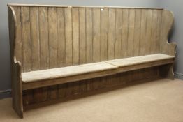Victorian pine settle, planked back and solid seat with shaped ends, L287cm, H132cm,