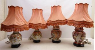 Pair Oriental style porcelain table lamps on plinths and three other similar style lamps,