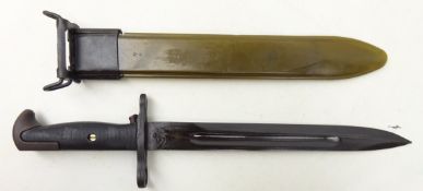 Bayonet in metal and plastic scabbard , the blade marked 'U.S.', blade L24.5cm, total L36.