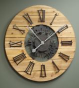 Large circular planked pine wall clock with Roman numerals,