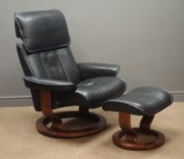 Ekornes Stressless swivel reclining armchair with matching footstool upholstered in black leather