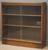 Mid 20th century oak bookcase with sliding glass doors, enclosing two adjustable shelves,