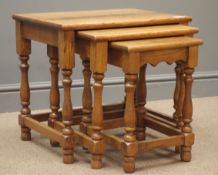 Early 20th century medium oak nest of three tables, turned supports, W50cm, H46cm,