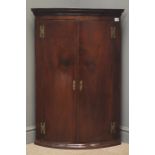 Victorian mahogany corner cabinet, projecting cornice, two cupboard doors enclosing three shelves,