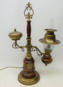 Electric lamp in the style of a Victorian oil burner, wood and brass effect body,