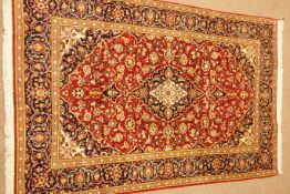 Kashan red fine ground rug, floral repeating border,