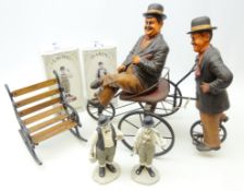 Pair Laurel and Hardy composite figures on four wheel bike, H50cm, another pair in bisque glaze,