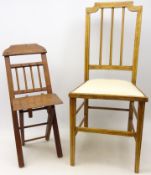 Child's or doll's mahogany stick back folding chair, with shaped bar back and X shaped frame,