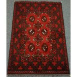 Persian red ground rug,