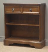 Mid 20th century oak bookcase, two drawers above two shelves, shaped plinth base, W75cm, H81cm,