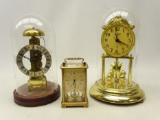 Late 20th century brass skeleton clock striking on the hour on plinth with glass dome (H29cm),