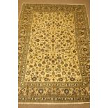 Kashan beige ground rug, floral and foliate field, repeating border,