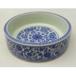 Chinese blue and white dish of circular form decorated with flowers amidst scrolling foliage and