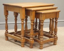 20th century nest three oak tables, turned supports joined by stretchers, (50cm x 40cm,