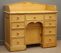 Victorian pine knee hole dressing table, raised shaped back, four short,