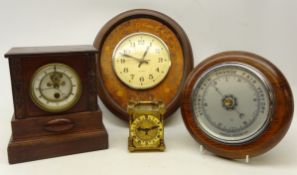 Early 20th century oak cased mantle clock with a visible escapement,