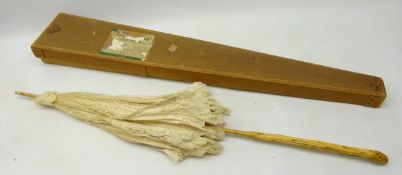 Early 20th century silk and lace parasol with cane handle and carved grip,