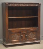 Oak open bookcase carved frieze fitted with two panel cupboard doors, block feet, W84cm, H94cm,