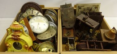 Large quantity of various clock dials, some with bezels, aneroid barometers,