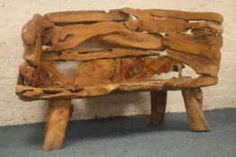 High back garden bench seat, formed from slabs of random jointed rough hewn hardwood,