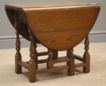 Small oval medium oak drop leaf coffee table with gate action support, W59cm, H48cm,