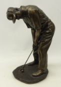 Bronzed figure of a golfer putting, indistinctly signed,