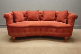 Kidney shaped sofa, deeply buttoned upholstered fabric, turned supports,