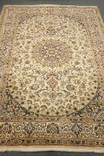 Fine Persian Nain beige ground rug, central medallion, floral field, repeating border,