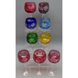 Seven harlequin cut glass hock glasses with faceted stems,