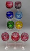 Seven harlequin cut glass hock glasses with faceted stems,