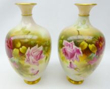 Pair Royal Worcester baluster vases, painted with roses amongst foliage by J.