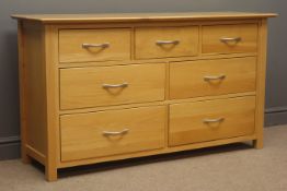 Light oak chest, three short and four long drawers, stile supports, W138cm, H78cm,