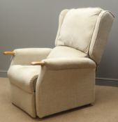 Electric reclining armchair, upholstered in beige fabric,